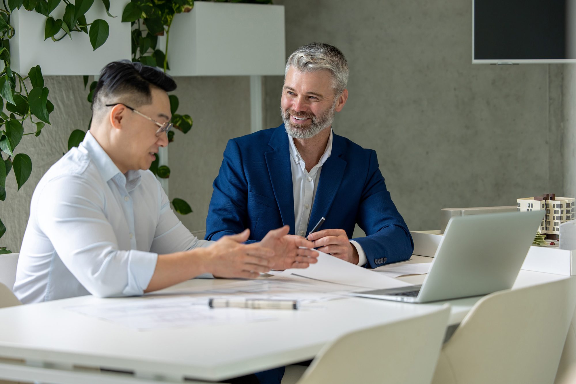 Two men reviewing business growth opportunities together